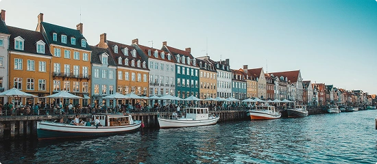 Copenhagen waterfront with colorful buildings and boats